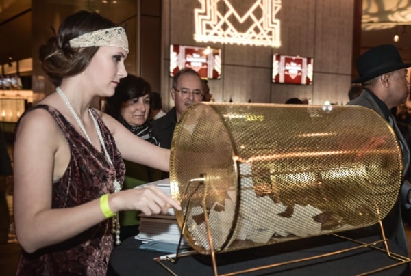 Women drawing winning ticket